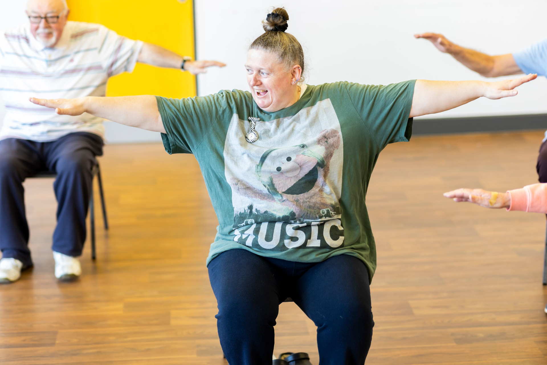 Adults enjoying an energetic group exercise class